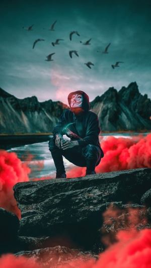 Anonymous figure with red smoke and birds