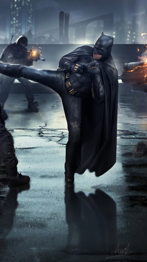 Batman performing a kick in a fight