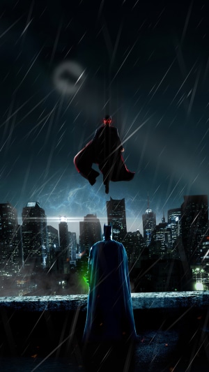 Batman and Superman in a rainy city