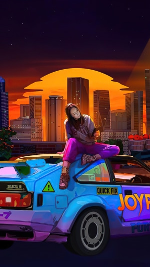 Woman sitting on a car with city skyline at sunset