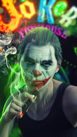 Joker smoking in front of a neon sign