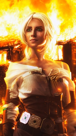 Ciri from The Witcher 3 in front of a burning building