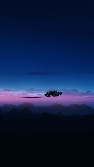 Astronaut floating on a wire above clouds