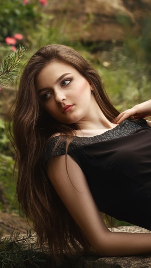 Girl in a black dress outdoors