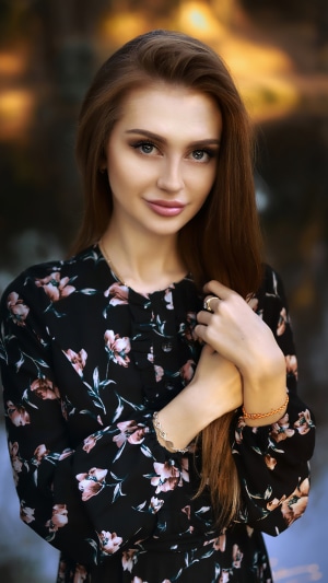 Cute redhead girl in floral dress