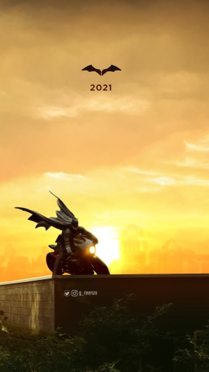 The Batman on a motorcycle with bat symbol and 2021
