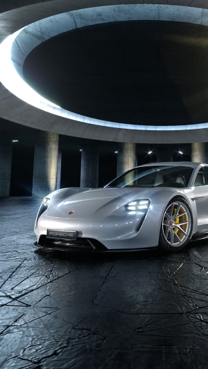 Silver Porsche Taycan 4S in a Circular Garage