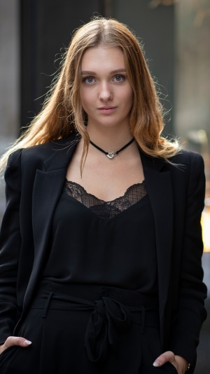 Blonde girl in black blazer and lace top