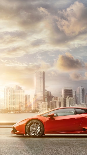 Red Lamborghini Huracan in front of Miami skyline 4K