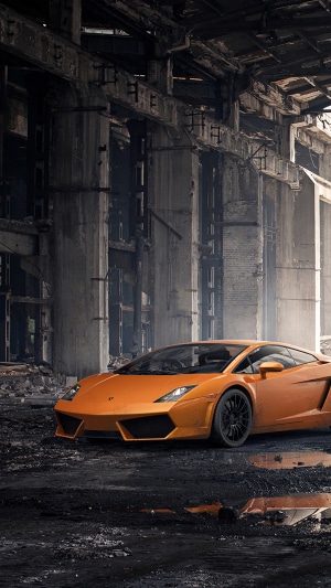 Orange Lamborghini in abandoned industrial building