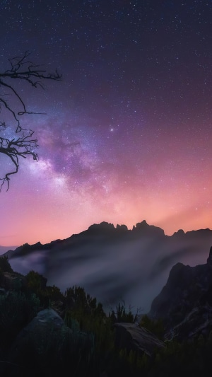 Milky Way over mountains at sunrise 4K