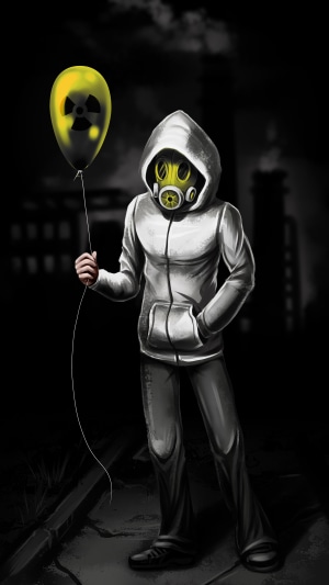 Person in gas mask holding radioactive balloon