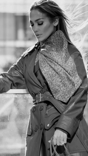Jennifer Lopez in monochrome trench coat and scarf