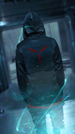 Person in a hoodie with a red symbol