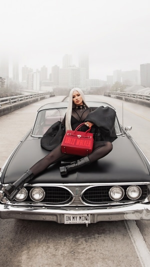 Iggy Azalea on a vintage car