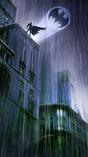 Batman in the rain with Bat-Signal