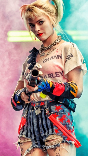 Harley Quinn from Birds of Prey holding a shotgun
