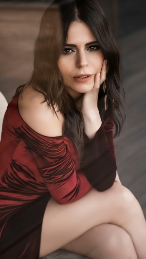 Simge in a red dress