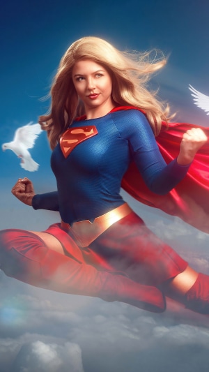 Supergirl flying with doves