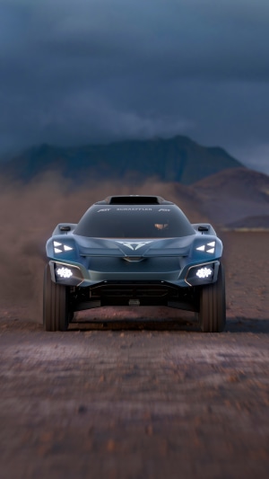 ABT Cupra Tavascan electric rally car driving on dirt road