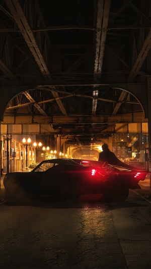 Batman from DC Comics driving the Batmobile
