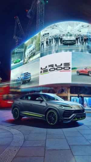 Lamborghini Urus on a city street at night