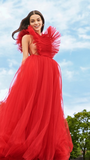 Rachel Zegler in a red dress