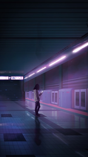 Person looking at phone in a futuristic subway station