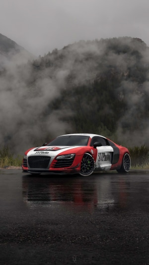 Red and white Audi R8 on a wet road
