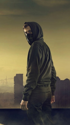 Alan Walker wearing a mask and hoodie