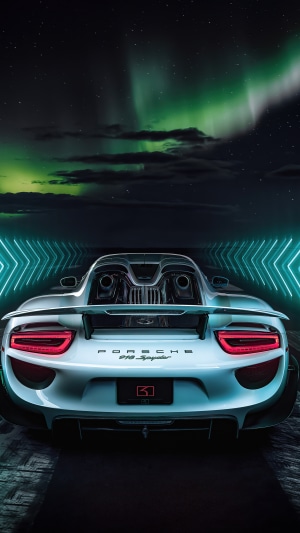 Porsche 918 Spyder rear view under aurora borealis