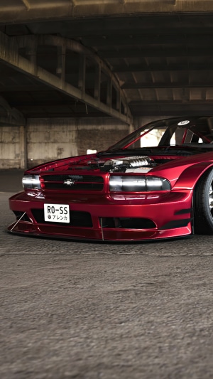 Red Chevrolet Impala SS with custom body kit