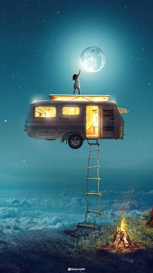 Girl reaching for the moon from a campervan