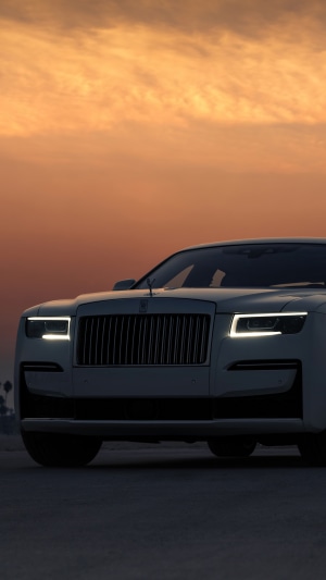 Rolls-Royce Ghost luxury car at sunset