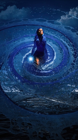 Woman in blue dress in swirling water