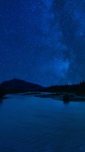 Milky Way over a lake and mountains