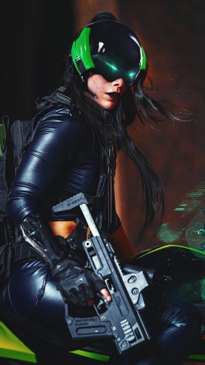 Woman in futuristic gear with a gun