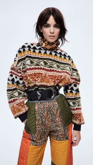 Kendall Jenner in patterned sweater and patchwork pants