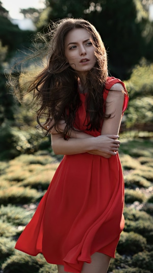 Model in a red dress outdoors