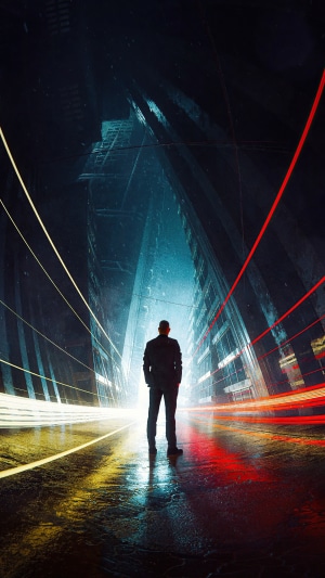 Man standing in a futuristic city with light trails