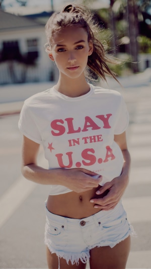 Rachel Cook wearing a "Slay in the USA" t-shirt