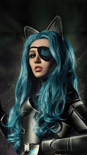 Woman with blue hair and cat eye patch cosplay
