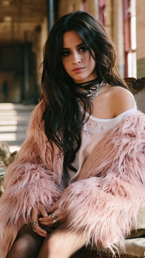 Camila Cabello wearing a pink fur coat