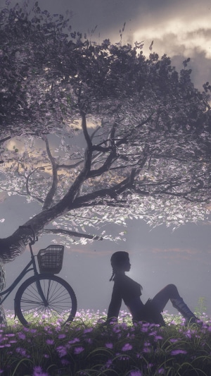 Girl sitting by a bicycle under a tree