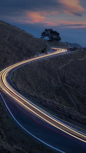 Long exposure of a winding road at dusk