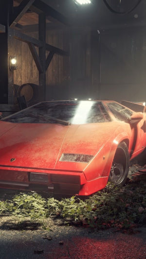 Red Lamborghini Countach in a dusty barn