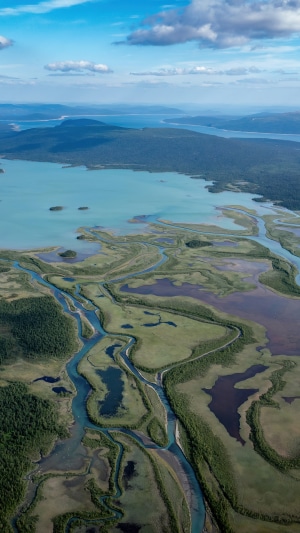 Aerial view of a winding river delta and lake