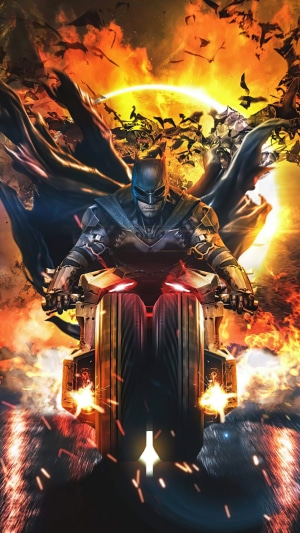 Batman on a motorcycle with bats and fire