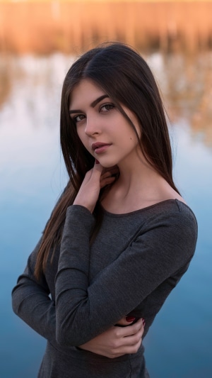 Brunette model by the water