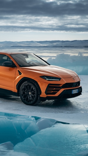 Orange Lamborghini Urus on Ice